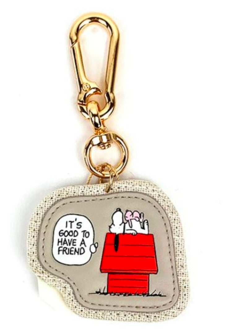 Gold-tone keychain clasp with fabric pouch featuring red doghouse graphic and speech bubble