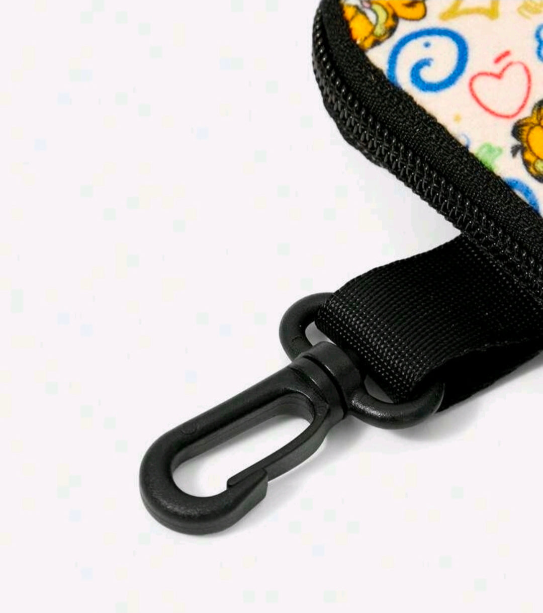Coin pouch with black carabiner clip and webbing strap attached to the zipper pouch
