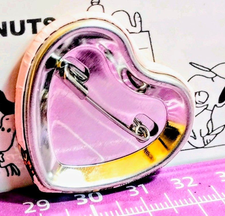 Holographic Snoopy phone grip in a heart-shaped holder with metal clasp.