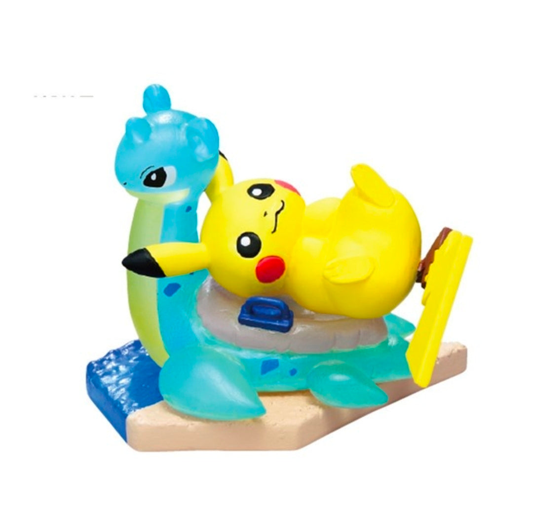 Seaside mini figure: blue character with black tail, holding yellow Pikachu on raft