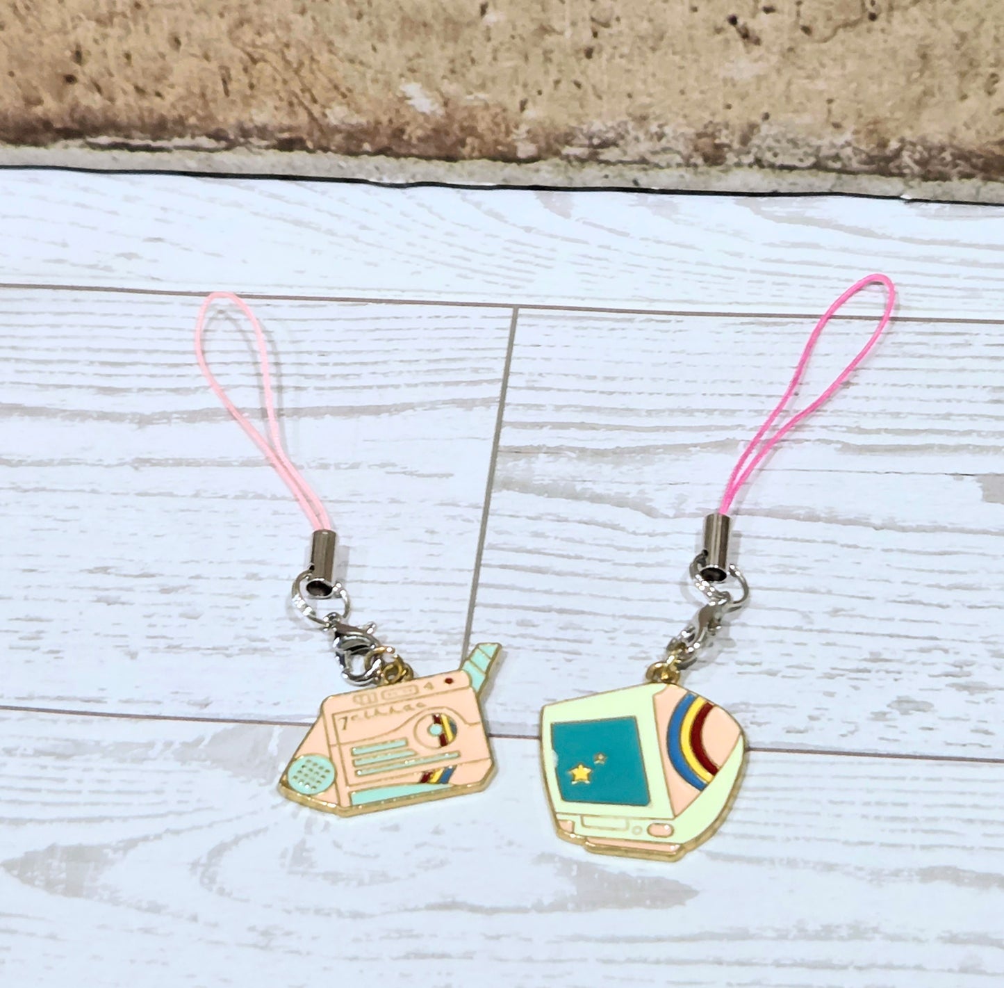 Retro phone charm set with two mini devices and pink lanyard cords, metal rings