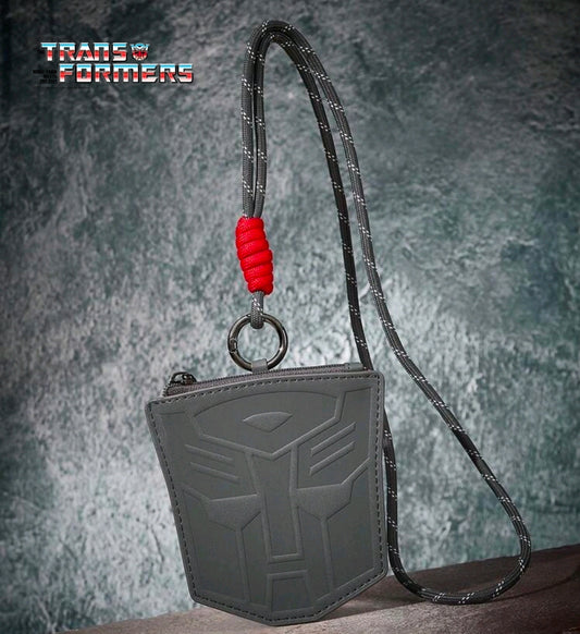 Gray zippered coin purse with embossed Autobot logo, red lanyard cord and metal ring